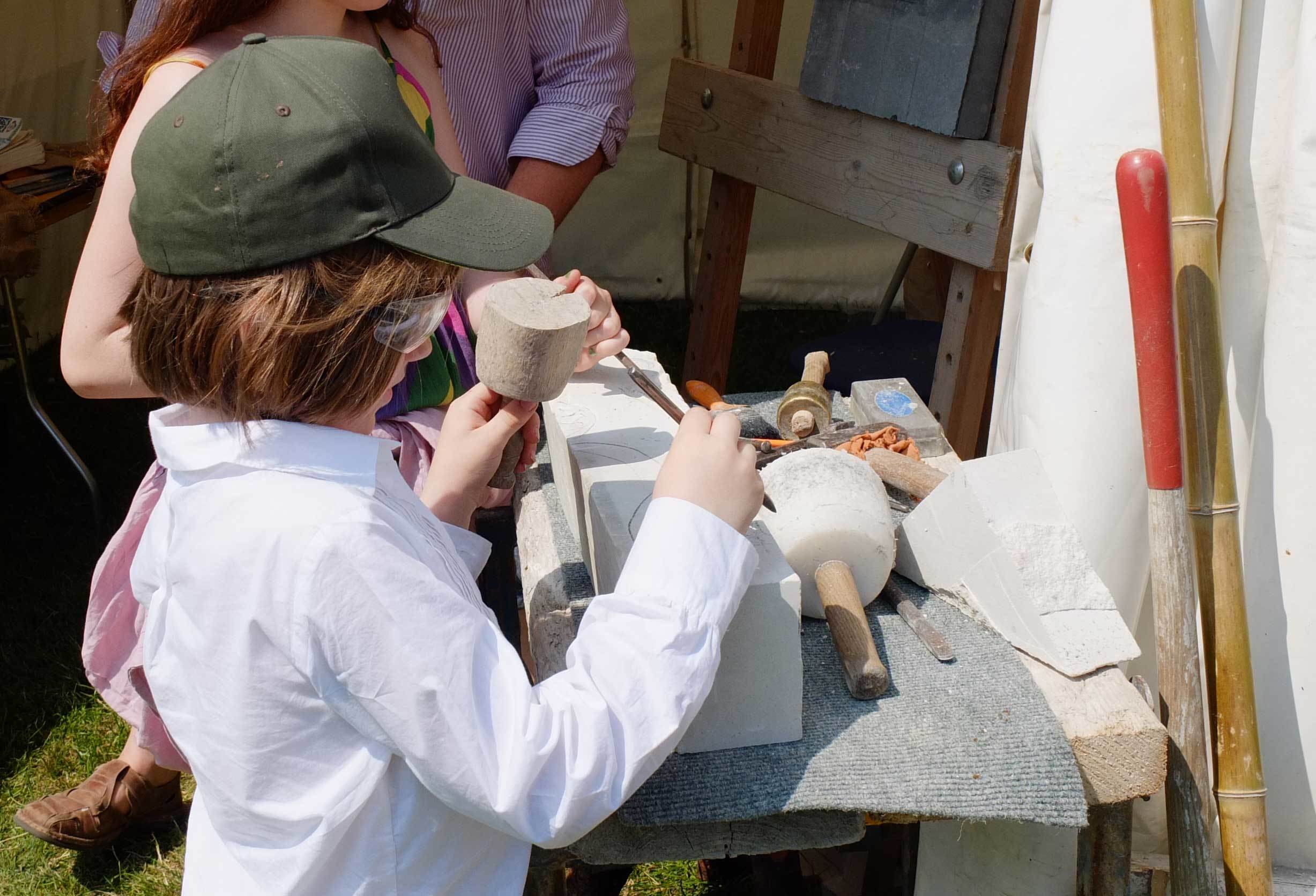 Children-carving-at-Stonemad-stand.jpg#asset:12230